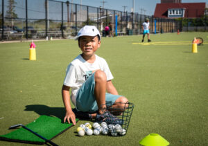 Boy with Golf Balls